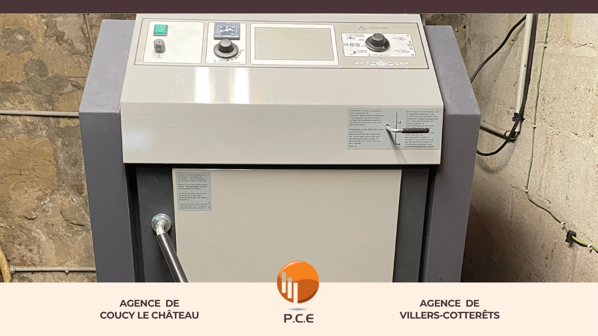 installation d’une chaudière à bois en remplacement d’une chaudière fioul, avec raccordement, contrôle et mise en service.